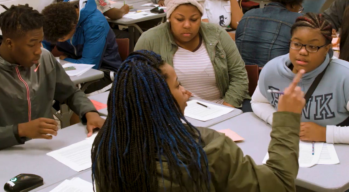 High school students engage in rigorous academic discourse as part of student-led team learning in the Model of Instruction for Deeper Learning.