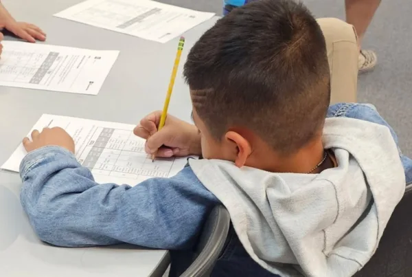 A Colorado Springs School District 11 student works at his desk.